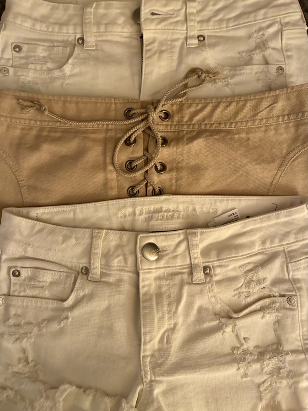 American Eagle White Distressed Denim Shorts with Tan Lace-Up Waist Accent